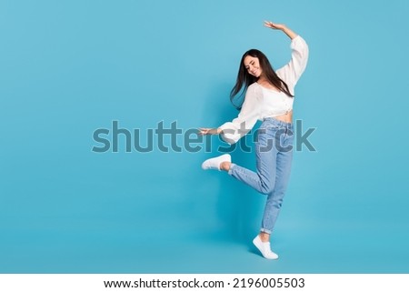 Full size photo of crazy carefree girl dancing partying spend pastime isolated on blue color background