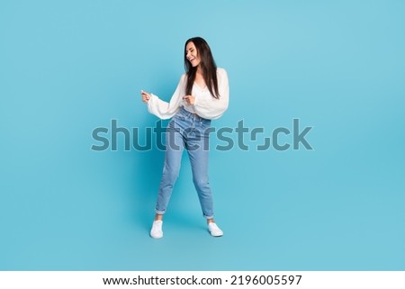 Full body photo of cheerful carefree lady have good mood dancing isolated on blue color background