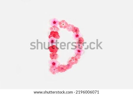 A letter D made from real fresh flowers. Creative floral font concept. Unique collection of letters and numbers for design. Spring, summer, autumn and valentines, creative idea, selective focus