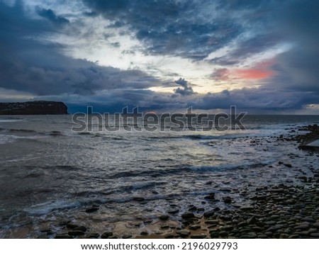 Rainy day aerial sunrise at the seaside from Macmasters Beach on the Central Coast, NSW, Australia. Royalty-Free Stock Photo #2196029793