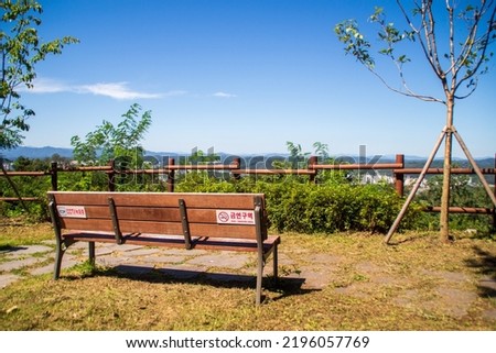 Park bench with a view over the city of Andong South Korea.