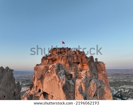 Aerial view of natural rock formations in the sunset, valley with cave houses in Cappadocia, Turkey. Natural landscape city lights at the night. Royalty-Free Stock Photo #2196062193