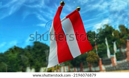 The small red and white Indonesian national flag