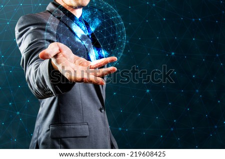 businessman showing glow sphere with network structure background