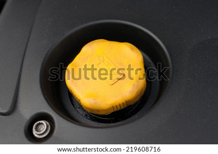 oil change in your car - yellow oil filler cap car
