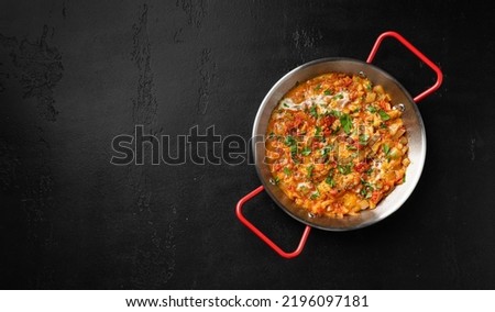 Menemen on a black background, top view, copy space Royalty-Free Stock Photo #2196097181
