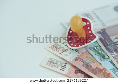 Russian money and a dummy, the concept of increasing fertility Royalty-Free Stock Photo #2196136227