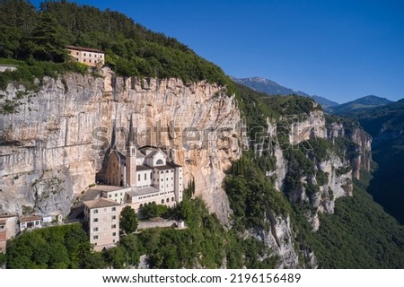 Church in the rock, Santuario della Madonna della Corona. Madonna della Corona Sanctuary view, surrounded by mountains. An old church, built around 1625, on a quiet, picturesque mountainside. Royalty-Free Stock Photo #2196156489