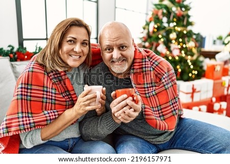 Middle age couple celebrating christmas day