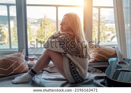Woman in knitted wool sweater relax at home in autumn day. Health care, authenticity, sense of balance and calmness.  Royalty-Free Stock Photo #2196163471