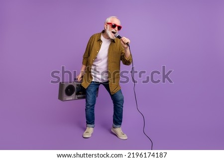 Full body photo of energetic grandpa white hair club dj singer dressed stylish yellow plaid shirt isolated on lilac purple color background