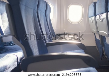 Empty seat on airplane while covid-19 outbreak destroy travel and airline business, health care and travel concept. Royalty-Free Stock Photo #2196205575