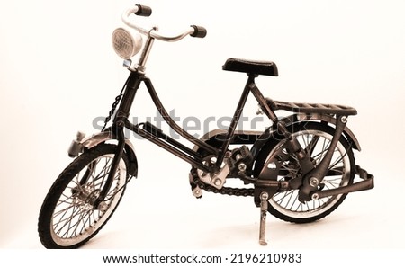 Miniature onthel bike or camel bike or roadster bike in cube on white background. Royalty-Free Stock Photo #2196210983