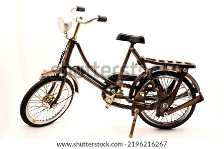 Miniature onthel bike or camel bike or roadster bike in cube on white background. Royalty-Free Stock Photo #2196216267