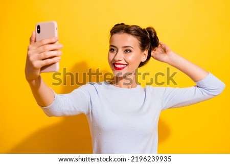 Photo of funny cute girl dressed white shirt tacking selfie modern device isolated yellow color background