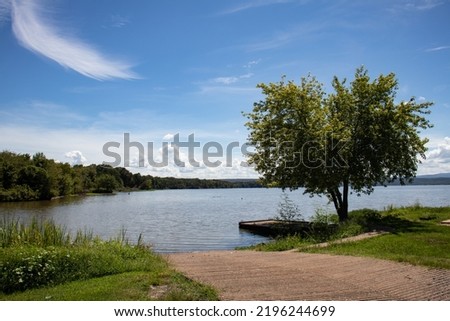 A loading dock and boat launch lets out on the Lake Dardanelle portion of the Arkansas River in Cabin Creek Park and Public Use Area in Knoxville, Johnson County, Arkansas River Valley, Arkansas. Royalty-Free Stock Photo #2196244699