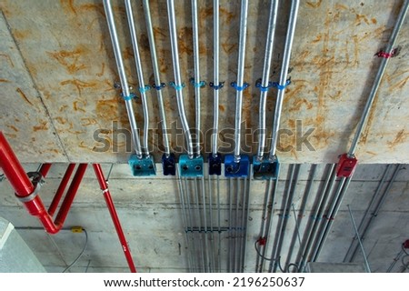 Electric conduit and sanitary fire pipe work, industry construction concept background