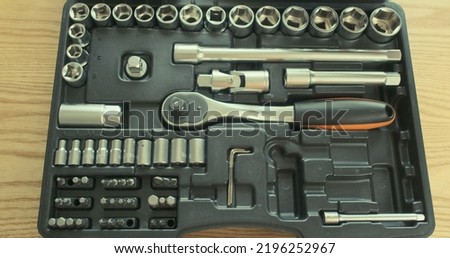 set of tools, takes a ratchet socket wrench. Top view, close-up.