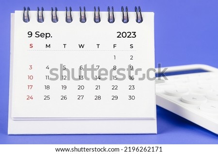 September 2023 Monthly desk calendar for 2023 year with calculator on purple background. Royalty-Free Stock Photo #2196262171