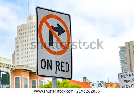 A street sign in San Francisco, California telling drivers that a right turn on a red light is not allowed. Royalty-Free Stock Photo #2196262853