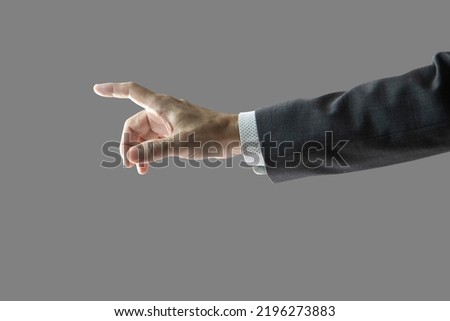 Right hand and forearm of a businessman with gray suit jacket sleeve with white shirt, pointing forward showing touching something gesture. Isolated on 50% gray. Clipping path included. Royalty-Free Stock Photo #2196273883