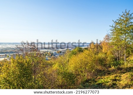 Landscape view with autumn colors on the trees
