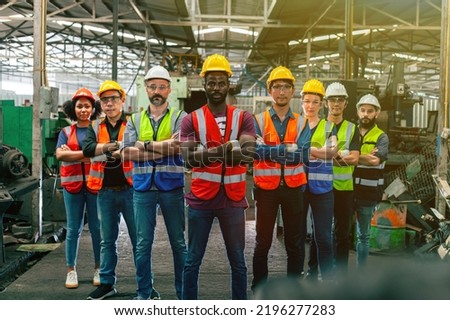 Artisans stand to show teamwork in an industrial plant. Diverse workers do what they do in an industrial setting. The concept of industrial people and workers in the manufacturing sector. The concept.