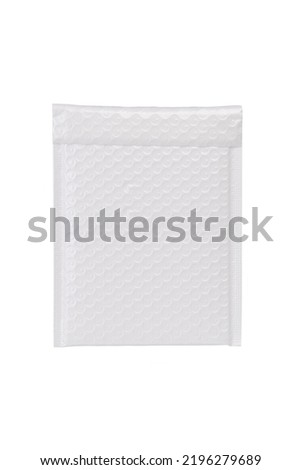 Close-up shot of a white bubble envelope for mailing cosmetics and beauty products. The bubble-lined envelope is isolated on a white background. Front view.