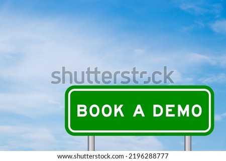 Green color transportation sign with word book a demo on blue sky with white cloud background Royalty-Free Stock Photo #2196288777