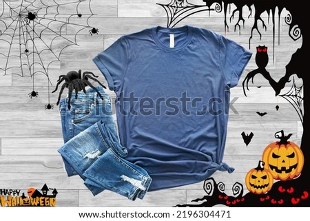 Mockup of a halloween Heather Midnight navy T-Shirt Blank Shirt Template Photo with Fall accessories and wooden background halloween shirt mockup