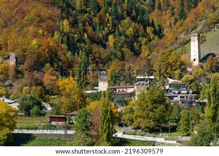 Beautiful view of the medieval village of Mestia, dotted with the famous towers of Svaneti on a sunny autumn day. Mountain landscape of Upper Svaneti, a region of Georgia.
