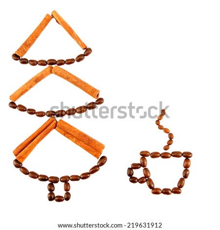 Christmas tree and a cup of coffee beans and cinnamon sticks isolated on white background.