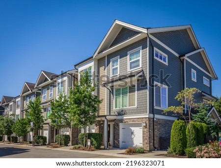 New Modern Apartment Buildings in Vancouver BC. Canadian modern residential architecture on sunny day. Nobody, street photo-Vancouver BC Canada Royalty-Free Stock Photo #2196323071
