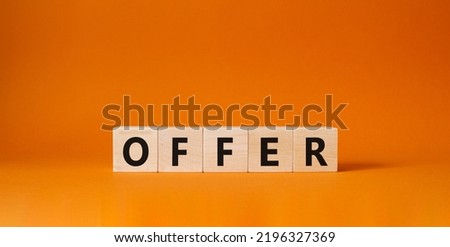 Offer symbol. Wooden cubes with word Offer . Beautiful orange background. Offer concept. Copy space.