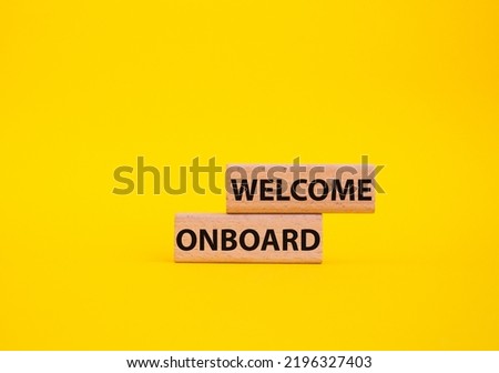 Welcome onboard symbol. Concept words Welcome onboard on wooden blocks. Beautiful yellow background. Business and Welcome onboard concept. Copy space.