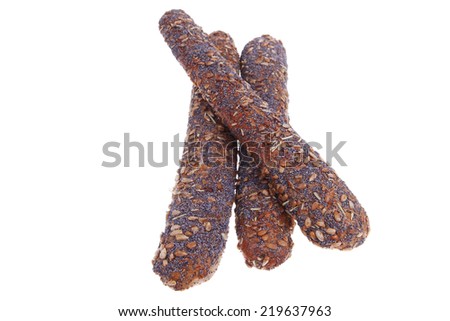 big french rye bread baguette topped with sunflower and poppy seeds isolated over white background