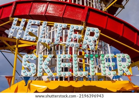 Close-up of the Helter Skelter sign on Herne Bay Pier in the seaside town of Herne Bay in Kent, UK.