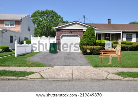 driveway entrance suburban home residential neighborhood USA clear blue sky
