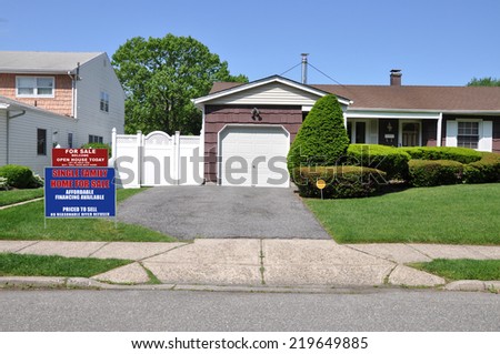 Real Estate For Sale Open House Welcome sign driveway entrance suburban home residential neighborhood USA clear blue sky