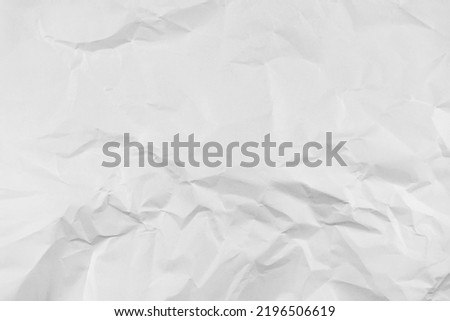 White crumpled paper texture background, clean white wrinkled paper, top view.	