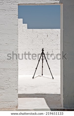 The unidentified building terrace with tripod standing there on Paros, Greece