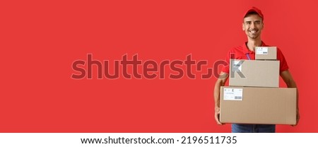 Delivery man with parcels on red background with space for text