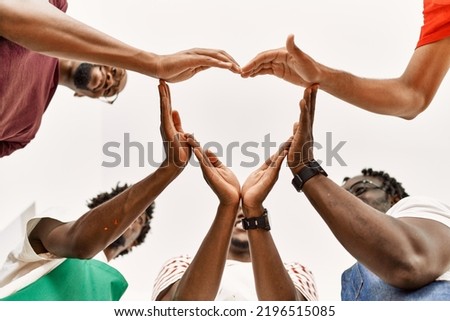 Group of young african american artist man smiling happy doing heart symbol with hands at art studio.