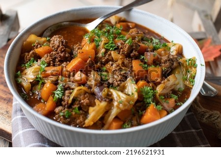 Ground beef stew with vegetables and cabbage in a bowl Royalty-Free Stock Photo #2196521931