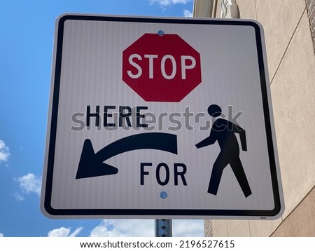 Stop Sign For Drivers to Let Pedestrians cross the Road or Street