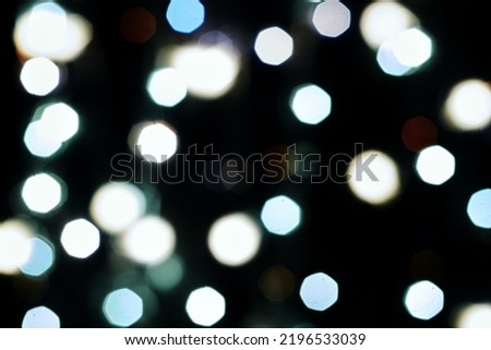 multicolored festive lights on a black background screensaver backdrop. High quality photo