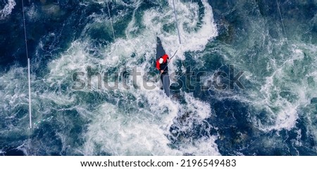 Top view boat of kayaker on mountain rough blue river, extreme sport kayak, aerial drone photo. Royalty-Free Stock Photo #2196549483
