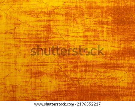 Yellow wall surface with rust