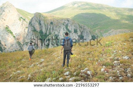 Photographers with backpack and digital camera in nature. Travel. Active lifestyle