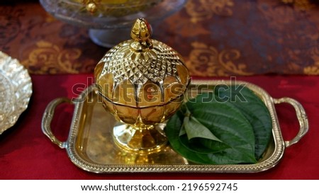 TEPAK SIRIH PINANG, a gold jar to put betel and areca nut in the traditional welcoming of guests in Indonesia Royalty-Free Stock Photo #2196592745